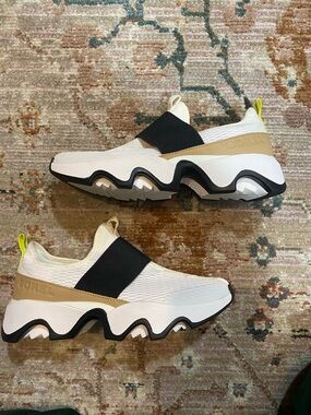 Sorel White Slip-On Sneaker with Black Strap and Tan Accent